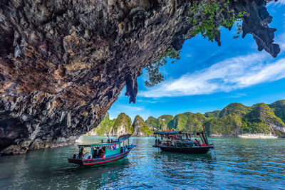 Scenic view of rocks in sea against sky