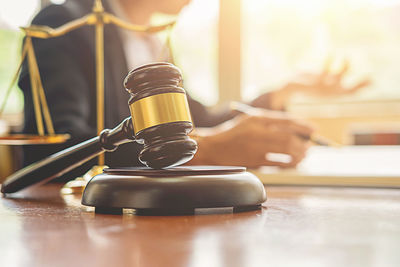 Close-up of gavel on table