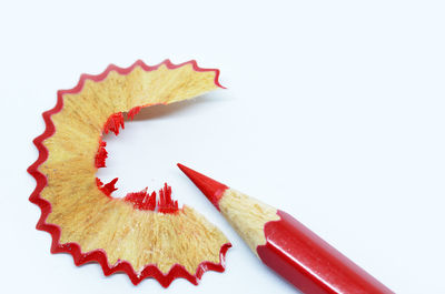 Close-up of colored pencils against white background