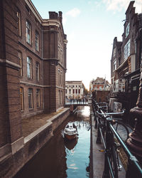 Canal passing through city buildings