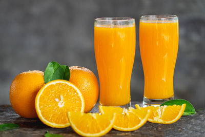 Close-up of orange juice on table