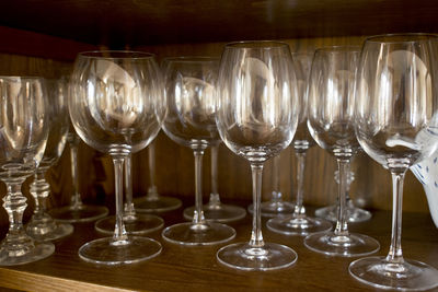 Close-up of wine glasses on table