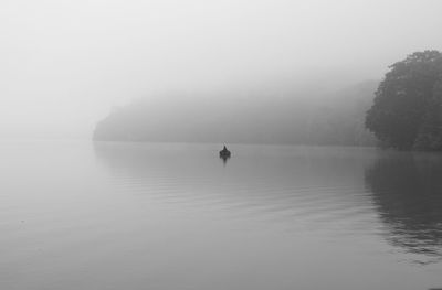 Scenic view of sea against sky during foggy weather