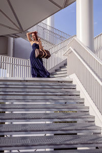 Woman sitting on staircase