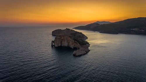 Scenic view of sea against dramatic sky