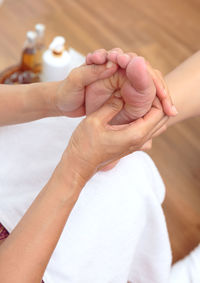 Close-up of people holding hands