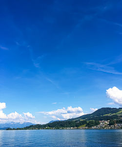 Scenic view of sea against blue sky