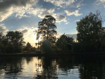 Scenic view of lake against sky during sunset