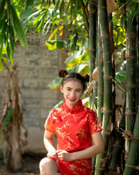 Portrait of a smiling young woman outdoors