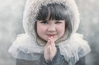 Portrait of cute girl in snow