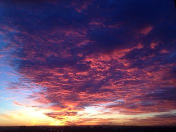 Low angle view of dramatic sky during sunset