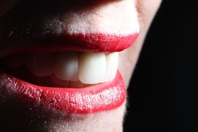 Extreme close up of woman with red lips