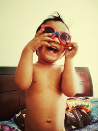 Portrait of shirtless boy at home