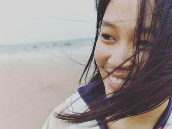Close-up of young woman at beach