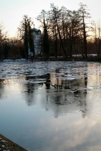 Scenic view of lake at sunset