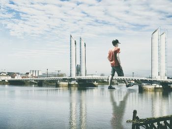 Full length of boy on boat against sky