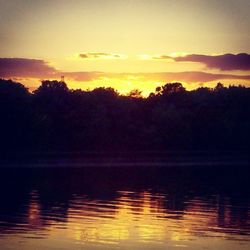 Scenic view of lake at sunset