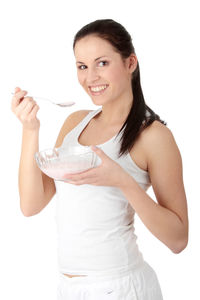 Portrait of a smiling young woman over white background