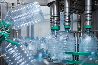 Close-up of bottles in industry