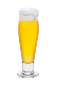 Close-up of beer glass against white background