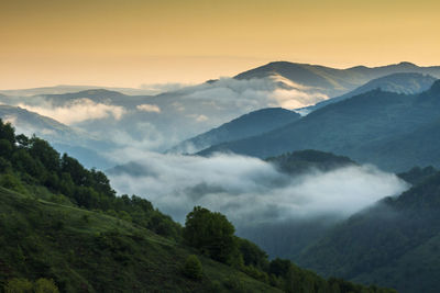 Scenic view of mountains against sky during sunset