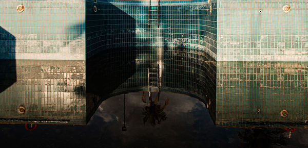 Reflection of building on glass window