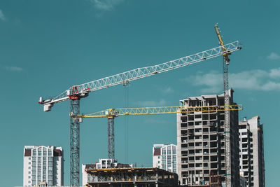 Buildings in city against sky