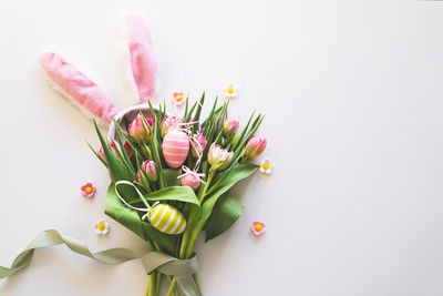 Happy easter. stylish dyed easter eggs with spring flowers