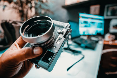 Close-up of hand holding camera