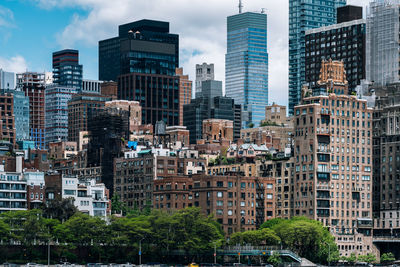 Buildings in city against sky