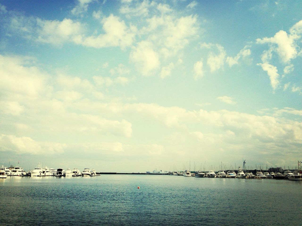 water, sky, waterfront, sea, cloud - sky, tranquility, nautical vessel, cloud, tranquil scene, transportation, scenics, built structure, nature, architecture, cloudy, river, beauty in nature, blue, mid distance, mode of transport