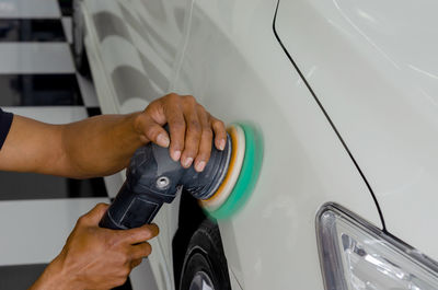 Close-up of hand holding car