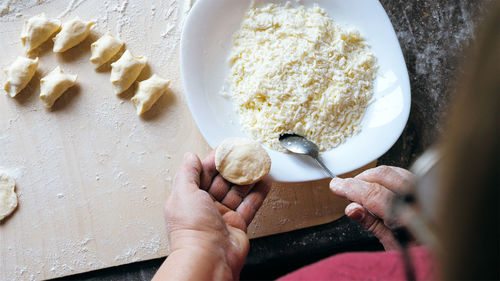 High angle view of woman preparing food at home