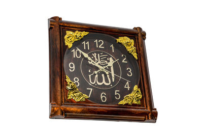 Close-up of clock against white background