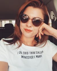 Portrait of young woman wearing sunglasses