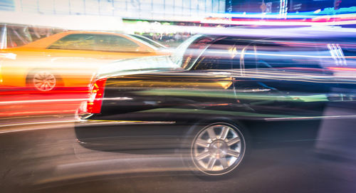 Blurred motion of car on street in city