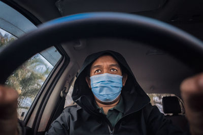 Portrait of man in car