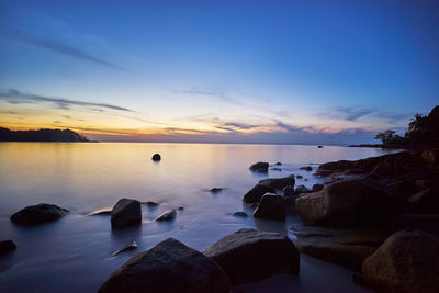 Scenic view of sea against sky at sunset