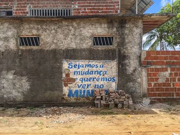 Information sign on window of abandoned building