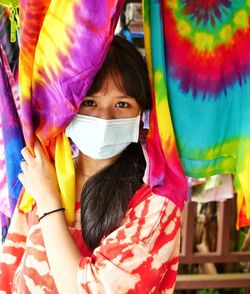 Portrait of woman holding colorful umbrella