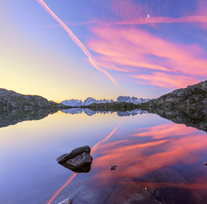 Scenic view of lake against sky during sunset