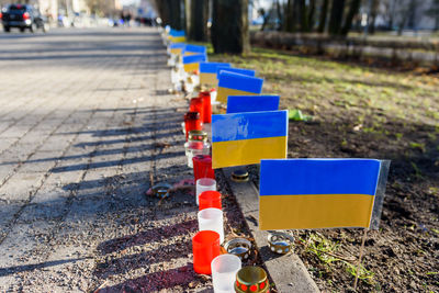 Small ukrainian flags with candles.
