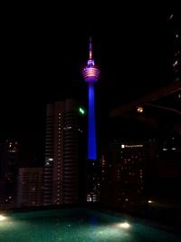 View of skyscrapers lit up at night