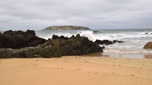 Scenic view of beach against sky