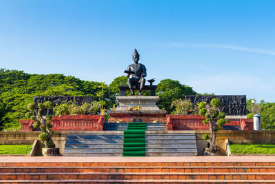 Statue against clear blue sky