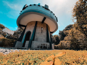 Low angle view of water tower against sky