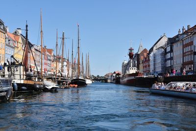 Boats in front of buildings in city