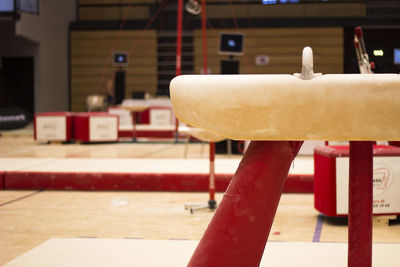 Close-up of bench on table against building