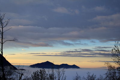 Silhouette of mountain during foggy weather