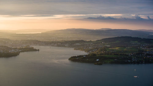 High angle view of lake and landscape against sky